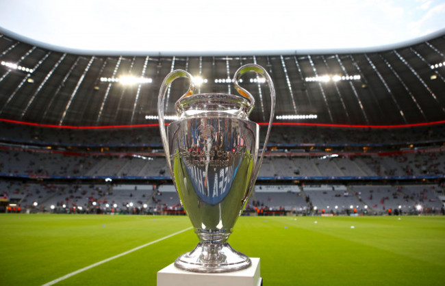 the-champions-league-trophy-on-display-on-the-pitch-ahead-of-the-match