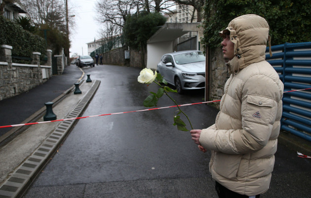 a-youth-holds-a-white-rose-at-the-entrance-of-a-private-catholic-school-after-a-teacher-of-spanish-has-been-stabbed-to-death-by-a-high-school-student-wednesday-feb-22-2023-in-saint-jean-de-luz-so