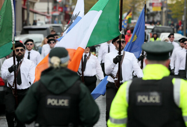 psni-officers-watch-as-a-colour-party-takes-part-in-a-parade-in-newry-co-down-the-political-party-saoradh-had-organised-the-parade-to-commemorate-hunger-strikes