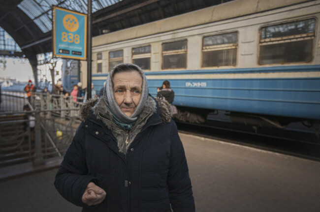 portrait-of-an-old-lady-waiting-for-the-train-ukrainian-people-mostly-women-mothers-with-children-or-elderly-the-war-refugees-as-seen-boarding-the-train-railroad-car-they-get-in-fast-after-waitin