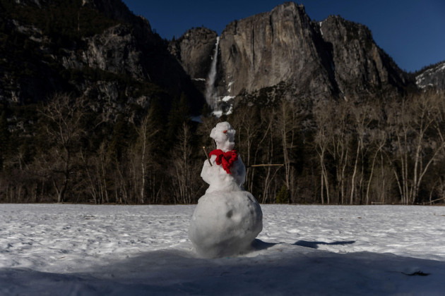 a-snowman-is-seen-neat-a-waterfall-in-yosemite-national-park-in-california-u-s-february-16-2023-reuterscarlos-barria