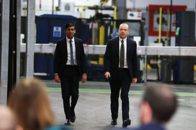 prime-minister-rishi-sunak-left-and-northern-ireland-secretary-chris-heaton-harris-hold-a-qa-session-with-local-business-leaders-during-a-visit-to-coca-cola-hbc-in-lisburn-co-antrim-in-northern-ir