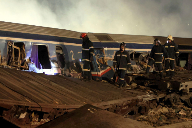 firefighters-operate-after-a-collision-in-tempe-near-larissa-city-greece-early-wednesday-march-1-2023-a-train-carrying-hundreds-of-passengers-has-collided-with-an-oncoming-freight-train-in-norther