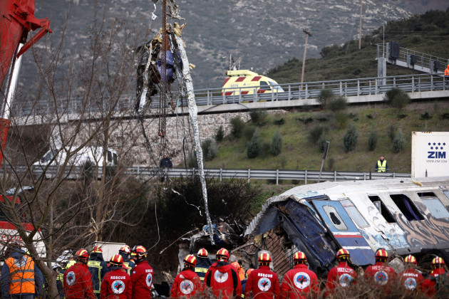 rescuers-stand-near-debris-of-trains-after-a-collision-in-tempe-about-376-kilometres-235-miles-north-of-athens-near-larissa-city-greece-wednesday-march-1-2023-rescuers-searched-wednesday-thro