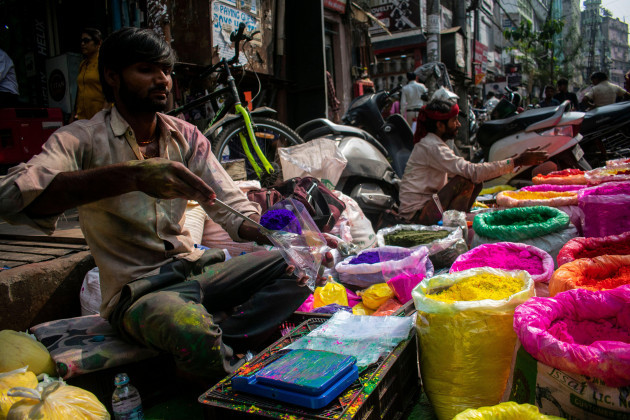 street-vendor-selling-colored-powder-or-gulal-at-a-market-ahead-of-holi-festival-in-guwahati-assam-india-on-6-march-2023-holi-is-a-celebration-of-the-divine-love-between-lord-krishna-and-radha-and