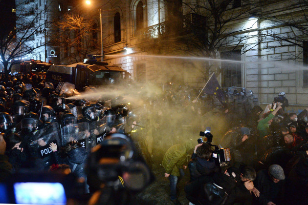 the-police-fire-tear-gas-and-water-cannon-at-protesters-outside-the-georgian-parliament-building-in-tbilisi-georgia-tuesday-march-7-2023-georgian-authorities-fired-tear-gas-and-water-cannon-at-pr