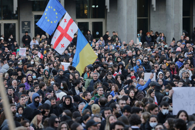 protesters-gather-with-georgian-ukrainian-national-and-eu-flags-outside-the-georgian-parliament-building-in-tbilisi-georgia-wednesday-march-8-2023-thousands-of-people-have-been-gathering-for-day