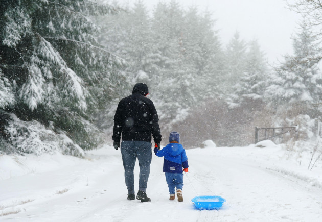 teofil-manta-and-his-three-year-old-son-dominic-from-clondalkin-walking-in-the-dublin-mountains-following-heavy-snow-fall-status-orange-snowice-warnings-have-been-put-in-place-for-large-portions-o