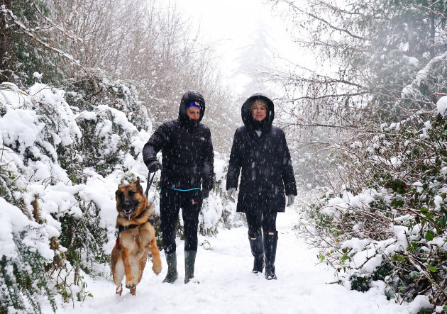 sylvia-ferguson-and-her-son-sam-left-walking-with-their-dog-jasper-in-the-dublin-mountains-following-heavy-snow-fall-status-orange-snowice-warnings-have-been-put-in-place-for-large-portions-of-the