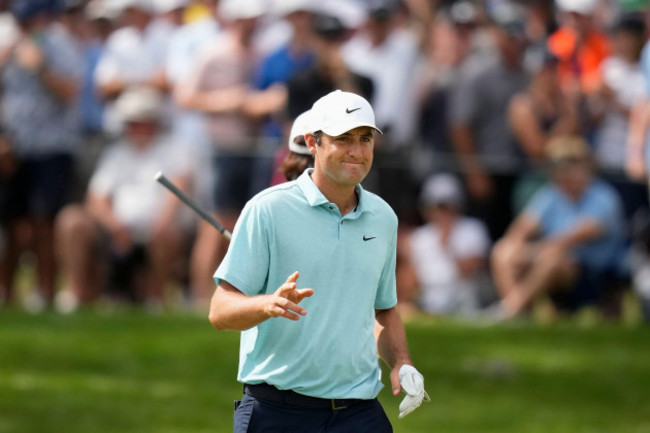 scottie-scheffler-gestures-after-making-a-birdie-putt-on-the-eighth-hole-during-the-final-round-of-the-players-championship-golf-tournament-sunday-march-12-2023-in-ponte-vedra-beach-fla-ap-phot