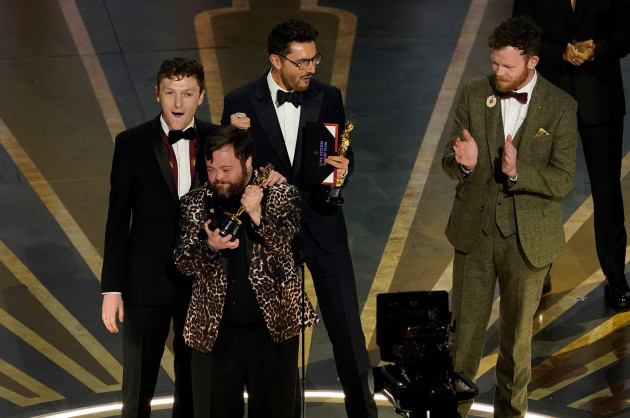 ross-white-from-left-james-martin-tom-berkeley-and-seamus-ohara-accept-the-award-for-best-live-action-short-film-for-an-irish-goodbye-at-the-oscars-on-sunday-march-12-2023-at-the-dolby-theatr