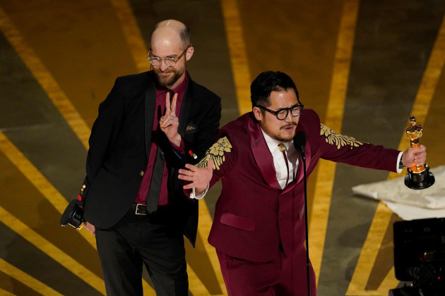 daniel-scheinert-left-and-daniel-kwan-accept-the-award-for-best-original-screenplay-for-everything-everywhere-all-at-once-at-the-oscars-on-sunday-march-12-2023-at-the-dolby-theatre-in-los-angel