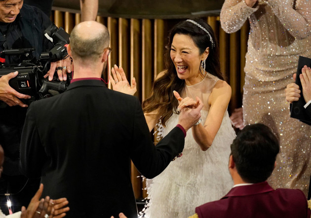 michelle-yeoh-center-reacts-with-excitement-as-daniel-scheinert-left-and-daniel-kwan-accept-the-award-for-best-director-for-everything-everywhere-all-at-once-at-the-oscars-on-sunday-march-12-2