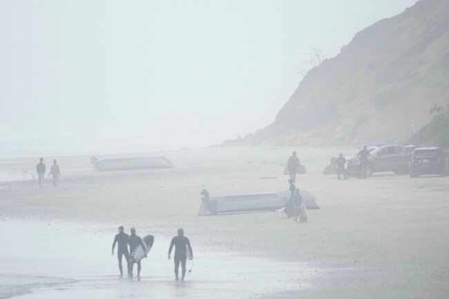 two-boats-one-overturned-sit-on-blacks-beach-sunday-march-12-2023-in-san-diego-authorities-say-multiple-people-were-killed-when-two-suspected-smuggling-boats-overturned-off-the-coast-san-diego