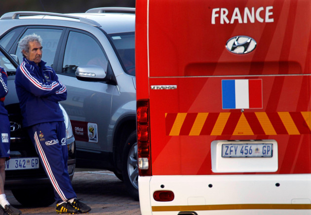 frances-national-soccer-team-coach-raymond-domenech-l-stands-next-to-the-team-bus-after-his-players-refused-to-take-part-in-a-training-session-in-knysna-near-cape-town-june-20-2010-a-day-after-l