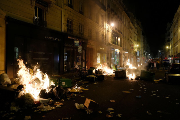 garbage-set-on-fire-by-protesters-after-a-demonstration-near-concorde-square-in-paris-thursday-march-16-2023-french-president-emmanuel-macron-has-shunned-parliament-and-imposed-a-highly-unpopular
