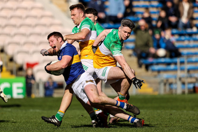 jimmy-feehan-is-tackled-by-lee-pearson-and-conor-mcnamee