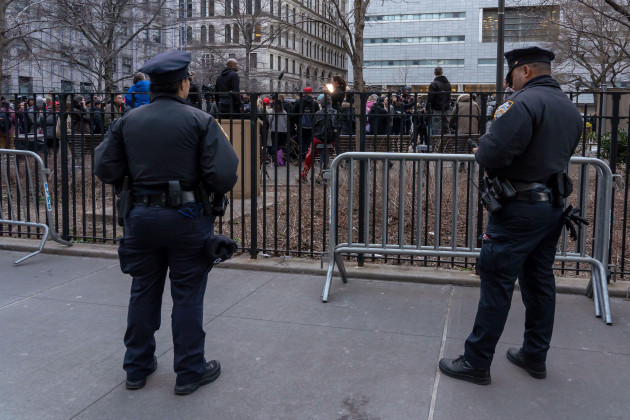new-york-united-states-20th-mar-2023-new-york-police-department-nypd-officers-keep-an-eye-on-a-rally-outside-the-court-house-in-support-of-former-president-donald-trump-amid-his-complex-legal