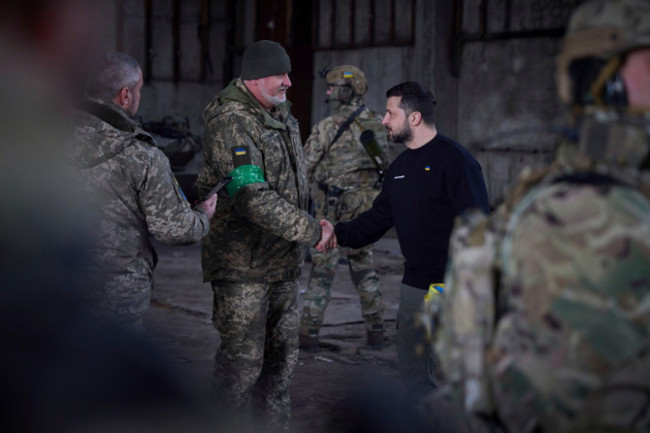 bakhmut-ukraine-22nd-mar-2023-ukrainian-president-volodymyr-zelenskyy-left-awards-a-state-medal-to-a-soldier-during-a-visit-to-frontline-positions-in-the-donetsk-region-march-22-2023-in-bakhmu