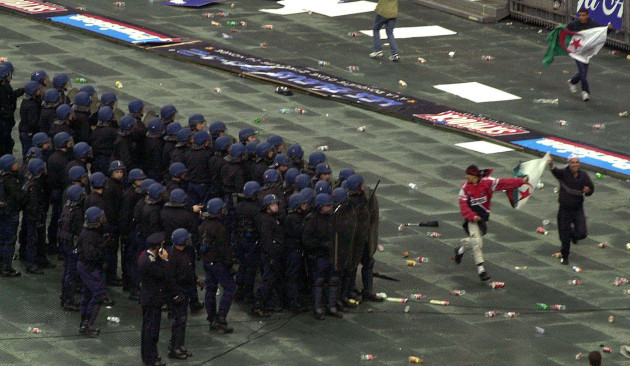 french-riot-policemen-take-positions-in-front-of-algerian-supportersstanding-during-the-soccer-match-between-france-and-algeria-october-62001-at-the-stade-de-france-stadium-the-match-was-stopped-a
