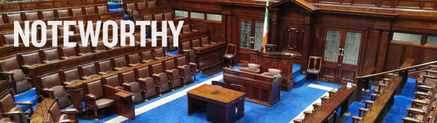 Empty Dáil chamber with the Irish flag near the centre with Noteworthy written in the foreground.
