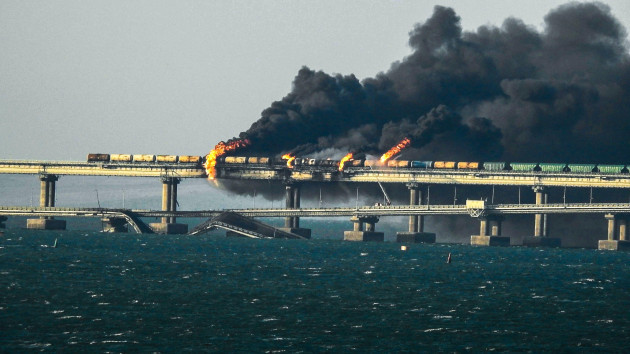crimea-russia-08th-oct-2022-black-smoke-billows-from-a-fire-on-the-kerch-bridge-that-links-crimea-to-russia-after-a-truck-exploded-on-saturday-october-8-2022-moscow-announced-a-truck-exploded