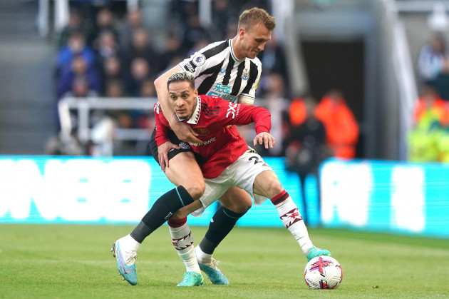 newcastle-uniteds-dan-burn-top-and-manchester-uniteds-antony-battle-for-the-ball-during-the-premier-league-match-at-st-james-park-newcastle-picture-date-sunday-april-2-2023
