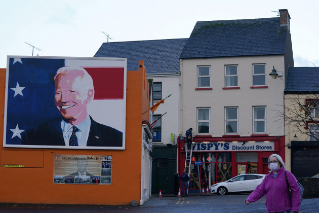 a-man-makes-repairs-to-a-discount-store-as-a-mural-of-democratic-u-s-presidential-nominee-and-former-vice-president-joe-biden-is-seen-which-was-erected-for-the-u-s-elections-in-the-ancestral-home-o