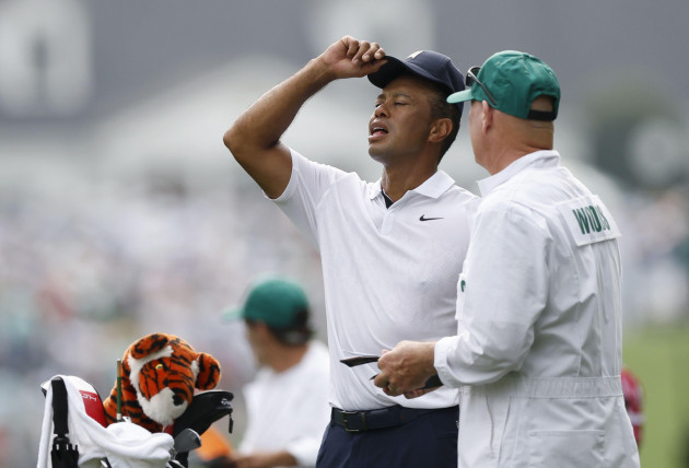 augusta-united-states-06th-apr-2023-tiger-woods-and-caddie-joe-lacava-stand-on-the-first-hole-fairway-in-the-first-round-of-the-masters-tournament-at-augusta-national-golf-club-in-augusta-georgia