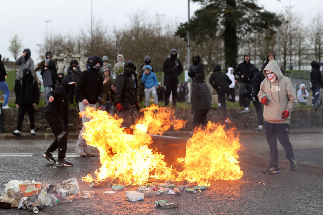 youths-throw-petrol-bombs-at-bin-to-block-a-street-in-the-creggan-area-of-londonderry-on-easter-monday-following-a-dissident-republican-parade-authorities-have-increased-security-measures-in-respons
