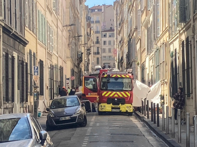 a-fire-truck-is-parked-in-a-street-near-the-scene-where-a-building-collapsed-in-marseille-southern-france-april-10-2023-french-authorities-said-the-death-toll-rose-to-four-people-after-two-bodies