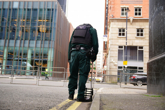 a-police-officer-from-the-tsg-demonstrates-a-security-inspection-of-a-drain-close-to-the-grand-central-hotel-belfast-ahead-of-the-arrival-of-us-president-joe-biden-for-his-visit-to-the-island-of-ir