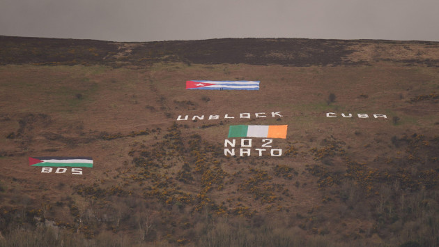 messages-are-displayed-on-black-mountain-which-overlooks-the-city-of-belfast-in-northern-ireland-as-us-president-joe-biden-delivers-his-keynote-speech-at-ulster-university-in-belfast-during-his-vis
