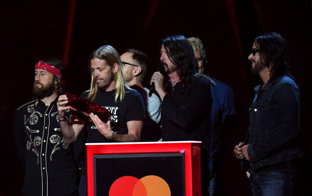 file-photo-dated-210218-of-foo-fighters-accepting-their-award-for-best-international-group-during-the-2018-brit-awards-show-held-at-the-o2-arena-london-taylor-hawkins-second-left-drummer-of-ro