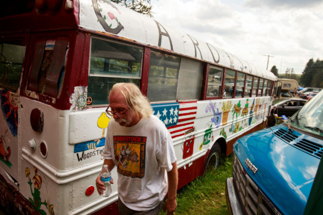 bethel-united-states-18th-aug-2019-a-man-walks-past-a-bus-parked-at-carols-dreams-across-from-hectors-inn-in-bethel-the-bus-was-used-in-1969-to-help-feed-attendees-at-woodstock-woodstock-organi