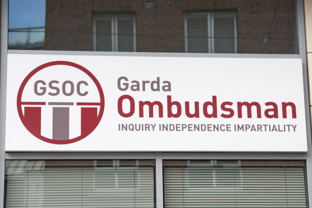 GSOC building: a white sign is affixed to a wall with windows above and below it. The sign has the GSOC logo and text which reads “Garda Ombudsman: Inquiry Independence Impartiality”
