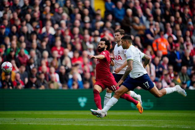 liverpools-mohamed-salah-left-tis-chased-by-tottenhams-cristian-romero-during-an-english-premier-league-soccer-match-between-liverpool-and-tottenham-hotspur-at-anfield-stadium-in-liverpool-sunday