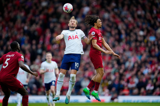 tottenhams-harry-kane-centre-jumps-for-the-ball-with-liverpools-trent-alexander-arnold-during-an-english-premier-league-soccer-match-between-liverpool-and-tottenham-hotspur-at-anfield-stadium-in-l