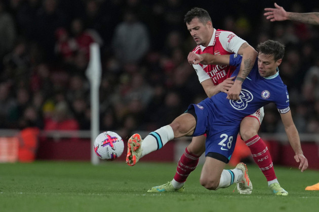 chelseas-cesar-azpilicueta-is-challenged-by-arsenals-granit-xhaka-rear-during-the-english-premier-league-soccer-match-between-arsenal-and-chelsea-at-the-emirates-stadium-in-london-tuesday-may-2