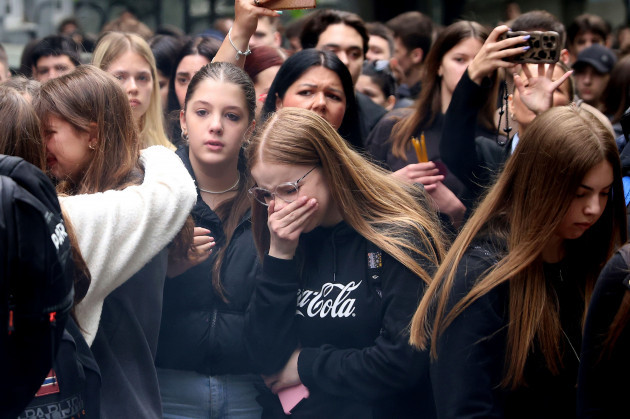 school-children-mourn-the-victims-near-the-vladislav-ribnikar-school-in-belgrade-serbia-thursday-may-4-2023-many-wearing-black-and-carrying-flowers-scores-of-serbian-students-on-thursday-paid-si