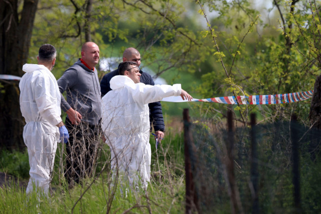 forensic-police-inspects-the-scene-around-a-car-in-the-village-of-dubona-some-50-kilometers-30-miles-south-of-belgrade-serbia-friday-may-5-2023-a-shooter-killed-multiple-people-and-wounded-mor