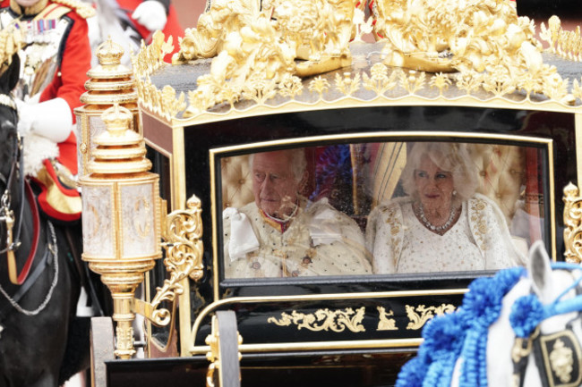 king-charles-iii-and-queen-camilla-are-carried-in-the-diamond-jubilee-state-coach-in-the-kings-procession-from-buckingham-palace-to-their-coronation-ceremony-london-picture-date-saturday-may-6-202