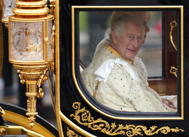 king-charles-iii-and-queen-camilla-are-carried-in-the-diamond-jubilee-state-coach-as-the-kings-procession-passes-along-the-mall-to-their-coronation-ceremony-london-picture-date-saturday-may-6-2023