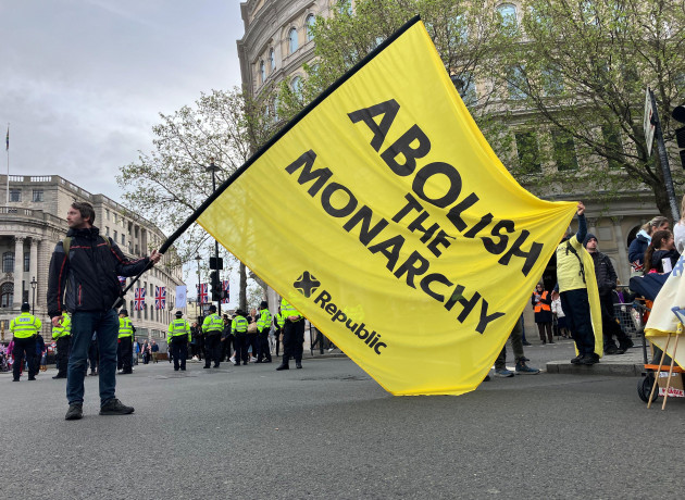london-uk-06th-may-2023-people-protest-against-the-monarchy-on-the-day-of-king-charles-iiis-coronation-ceremony-with-one-man-waving-a-large-flag-reading-abolish-the-monarchy-credit-christoph