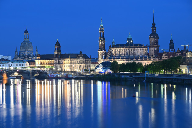 dresden-germany-08th-may-2023-the-historic-old-town-backdrop-on-the-elbe-with-the-frauenkirche-l-r-the-standehaus-the-hofkirche-the-city-hall-the-hausmannsturm-and-the-kreuzkirche-are-illumi