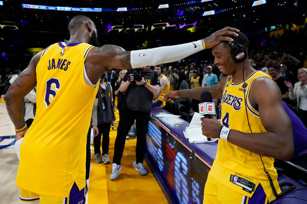 los-angeles-lakers-lebron-james-left-congratulates-lonnie-walker-iv-after-the-lakers-defeated-the-golden-state-warriors-104-101-in-game-4-of-an-nba-basketball-western-conference-semifinal-monday-m