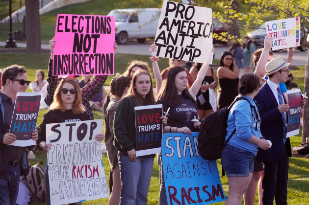 people-protest-outside-a-building-on-the-campus-of-saint-anselm-college-hosting-a-cnn-televised-town-hall-gathering-with-former-president-donald-trump-wednesday-may-10-2023-in-manchester-n-h-ap