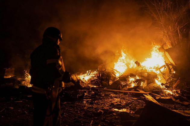 in-this-photo-provided-by-the-ukrainian-emergency-situations-ministry-firefighters-put-out-fire-caused-by-fragments-of-a-russian-rocket-after-it-was-shot-down-by-air-defense-system-during-the-night-r