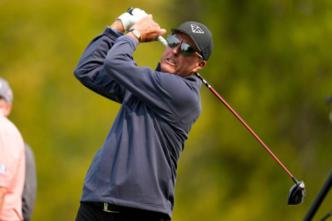 phil-mickelson-watches-his-tee-shot-on-the-16th-hole-during-a-practice-around-for-the-pga-championship-golf-tournament-at-oak-hill-country-club-on-tuesday-may-16-2023-in-rochester-n-y-ap-photoa