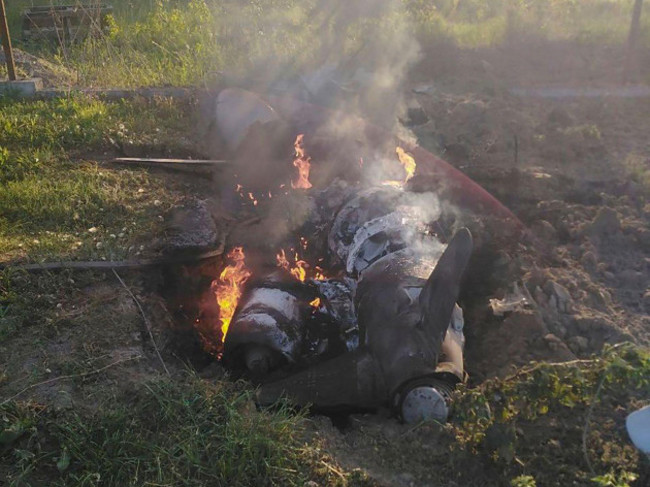 in-this-photo-provided-by-the-ukrainian-police-press-office-fragments-of-a-russian-rocket-which-was-shot-down-by-ukraines-air-defence-system-are-seen-after-the-night-rocket-attack-in-the-kyiv-region